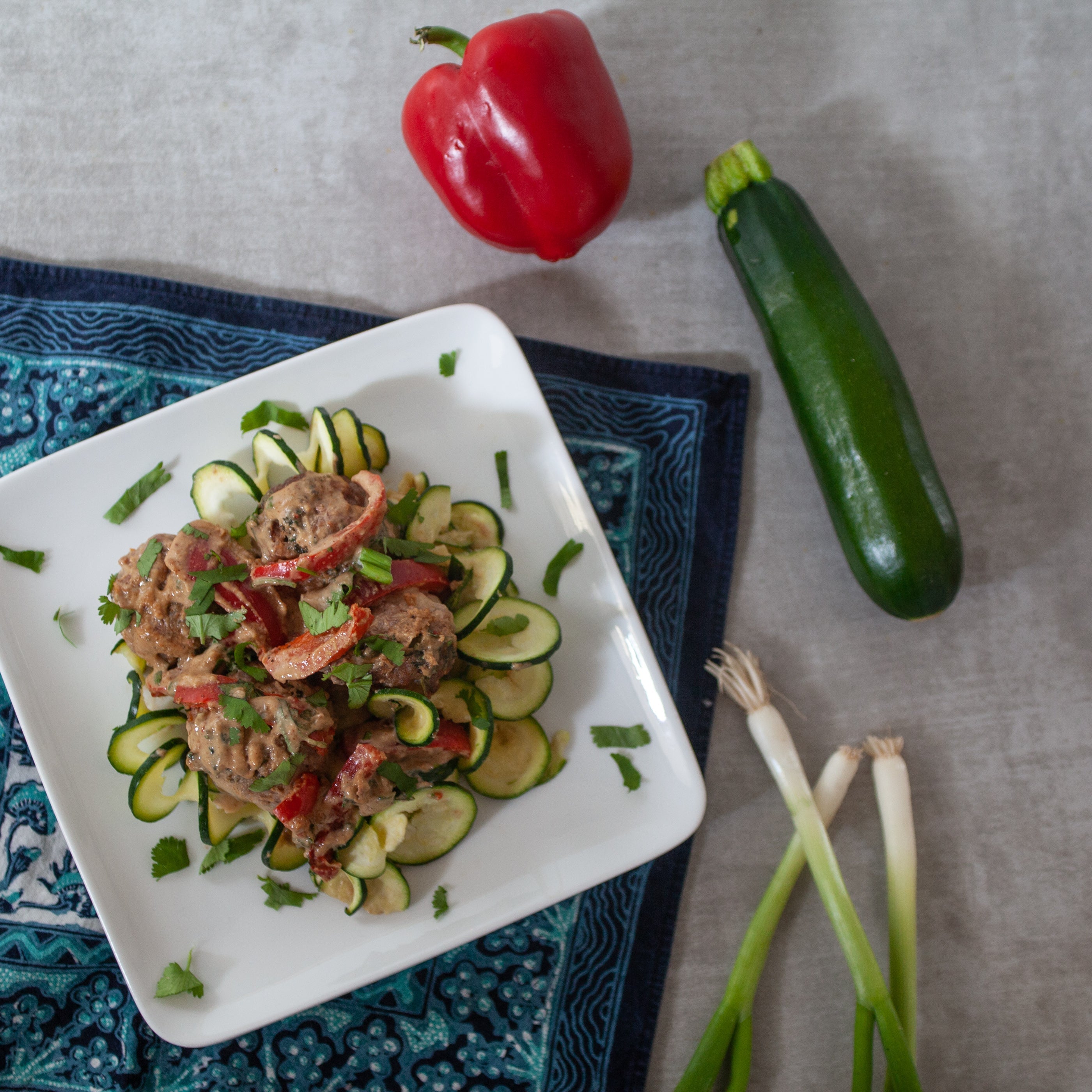 Frozen - Pork Meatballs w/Zucchini, Bell Pepper and Sesame-Tahini-Almond Sauce